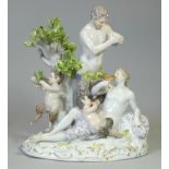A Meissen porcelain figure group depicting Bacchantes (worshipers of Bacchus) and a faun, on rocky