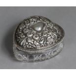 An Edwardian cut glass heart-shaped box with silver pull-off lid embossed with central cartouche &