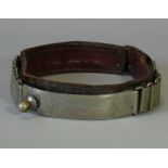 A 19th century German leather dog collar, with white metal adjustable clasp fitted with brass