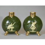 A PAIR OF MOORE Bros. PORCELAIN PILGRIM FLASKS with pate-sur-pate decoration of cupids leap-frogging