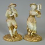 A pair of Royal Worcester porcelain male & female figures of Strephon the boy piper & his companion,