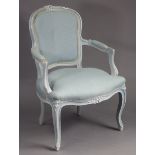 A continental-style pale grey painted wooden frame easy chair with padded back & sprung seat