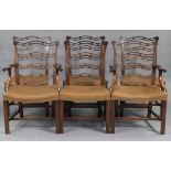 A set of six Georgian mahogany ladder-back dining chairs with pierced & shaped backs, brass
