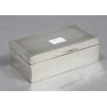 *WITHDRAWN* A George V silver cigarette box of rectangular shape, with engine-turned border to the