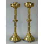 A PAIR OF VICTORIAN GILT-BRASS LARGE ALTAR CANDLESTICKS, each with raised “fleur-de-lys” pierced