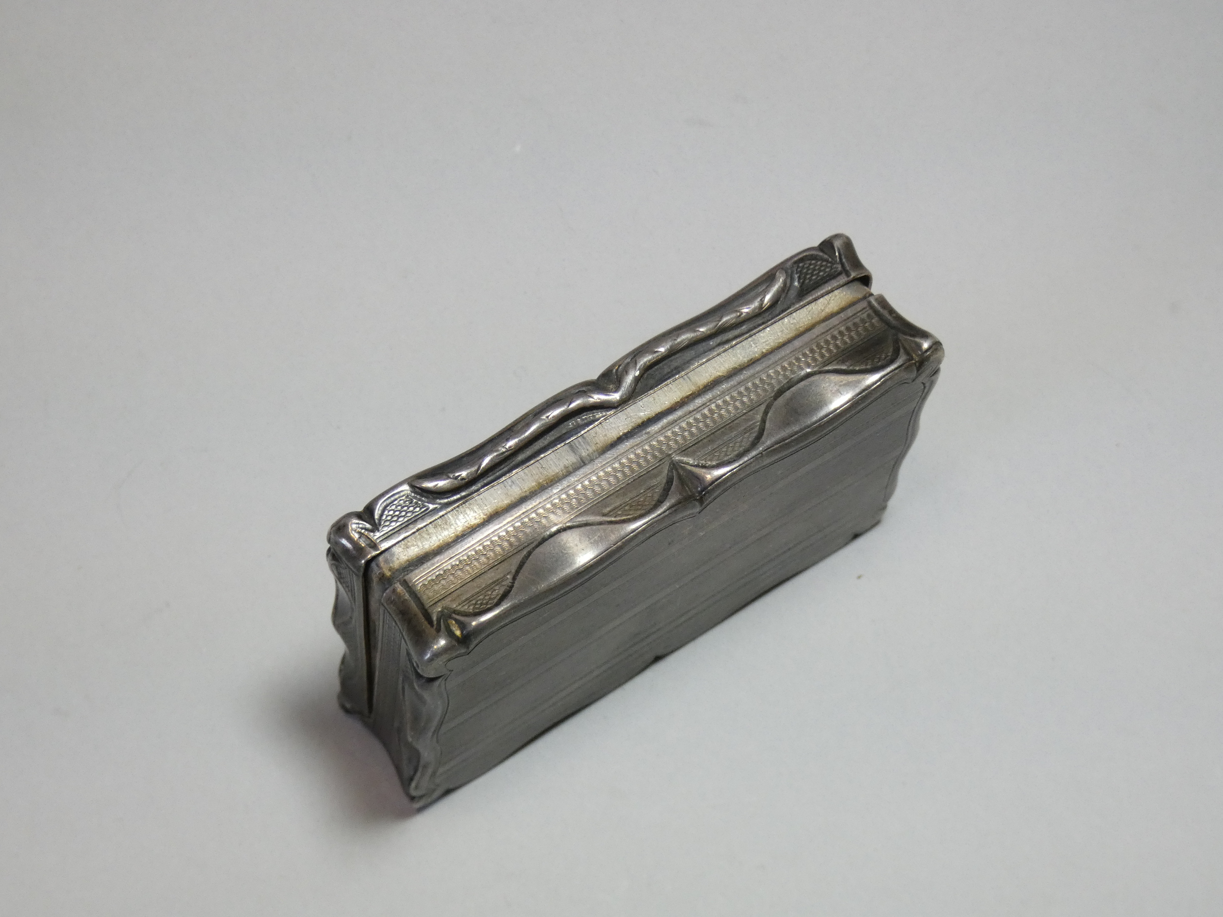 A Victorian silver snuff box, of shaped rectangular form with engine-turned decoration, engraved - Image 3 of 5