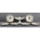 A mid-19th century English porcelain dessert service with brightly-coloured mixed flowers to the