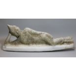 A carved alabaster buddhistic statue of a reclining figure, " long.