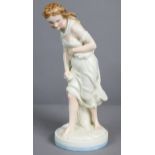 “Against The Wind”, a Royal Worcester porcelain standing figure of a young bare-foot woman dressed