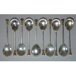 A set of ten George V parcel-gilt silver seal-top coffee spoons; Sheffield 1920-1, by Thos. Bradbury