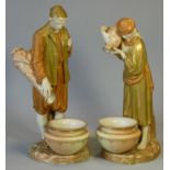 A pair of Royal Worcester porcelain standing male & female figures of Eastern Water Carriers (