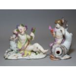An 18th century Meissen porcelain figure of a reclining putto feeding grapes to a leopard, on scroll