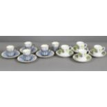 Five Aynsley porcelain coffee cans with pierced silver holders (Sheffield 1923, one saucer & two