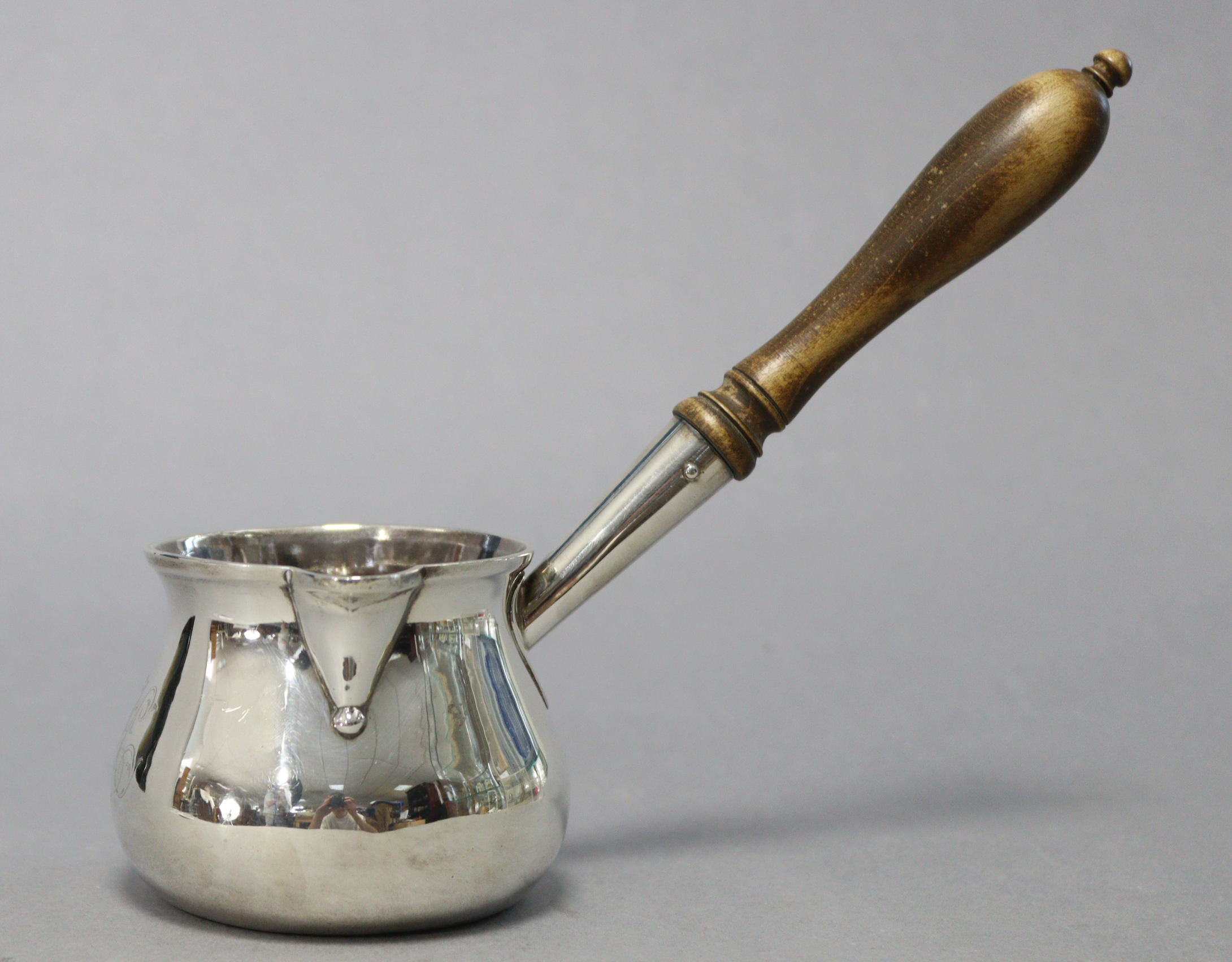 An early George III silver brandy saucepan of squat round shape, with engraved monogram & turned