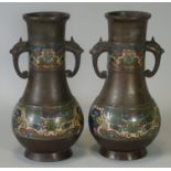 A pair of late 19th/early 20th century Chinese bronze & cloisonné baluster vases, each with bands of