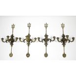 A SET OF FOUR EARLY 20th CENTURY GILT BRASS WALL LIGHTS, each with 'trident-fork' backs, & three