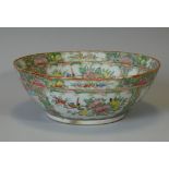 A 19th century Chinese porcelain famille rose punch bowl, decorated in Canton enamels with figure