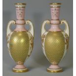 A pair of Coalport porcelain ‘jewelled’ two-handled vases of slender ovoid form, each with pink