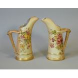 A pair of Royal Worcester porcelain ‘tusk’ ice jugs with antler handles, blush-ivory ground with