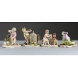 A SET OF FOUR MEISSEN PORCELAIN FIGURES OF PUTTI REPRESENTING THE ELEMENTS OF FIRE, WATER, AIR, &