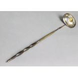 A silver toddy 'coin' ladle with spiral-twist whalebone handle, inset George III half guinea to the