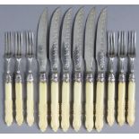Six pairs of Edwardian silver dessert knives & forks, with engraved & embossed decoration, & foliate