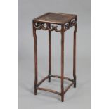 A Chinese hardwood square urn stand with cared & pierced frieze, on slender shaped supports, 12”