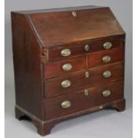 A 19th century mahogany bureau, the fall-front enclosing a fitted interior above an arrangement of