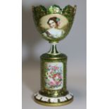 A 19th century BOHEMIAN GREEN & WHITE-OVERLAID GLASS VASE of goblet form on tall cylindrical foot,