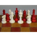 A late 19th century Staunton-type ivory chess set, of white & red stain, un-marked, the King 2¼”