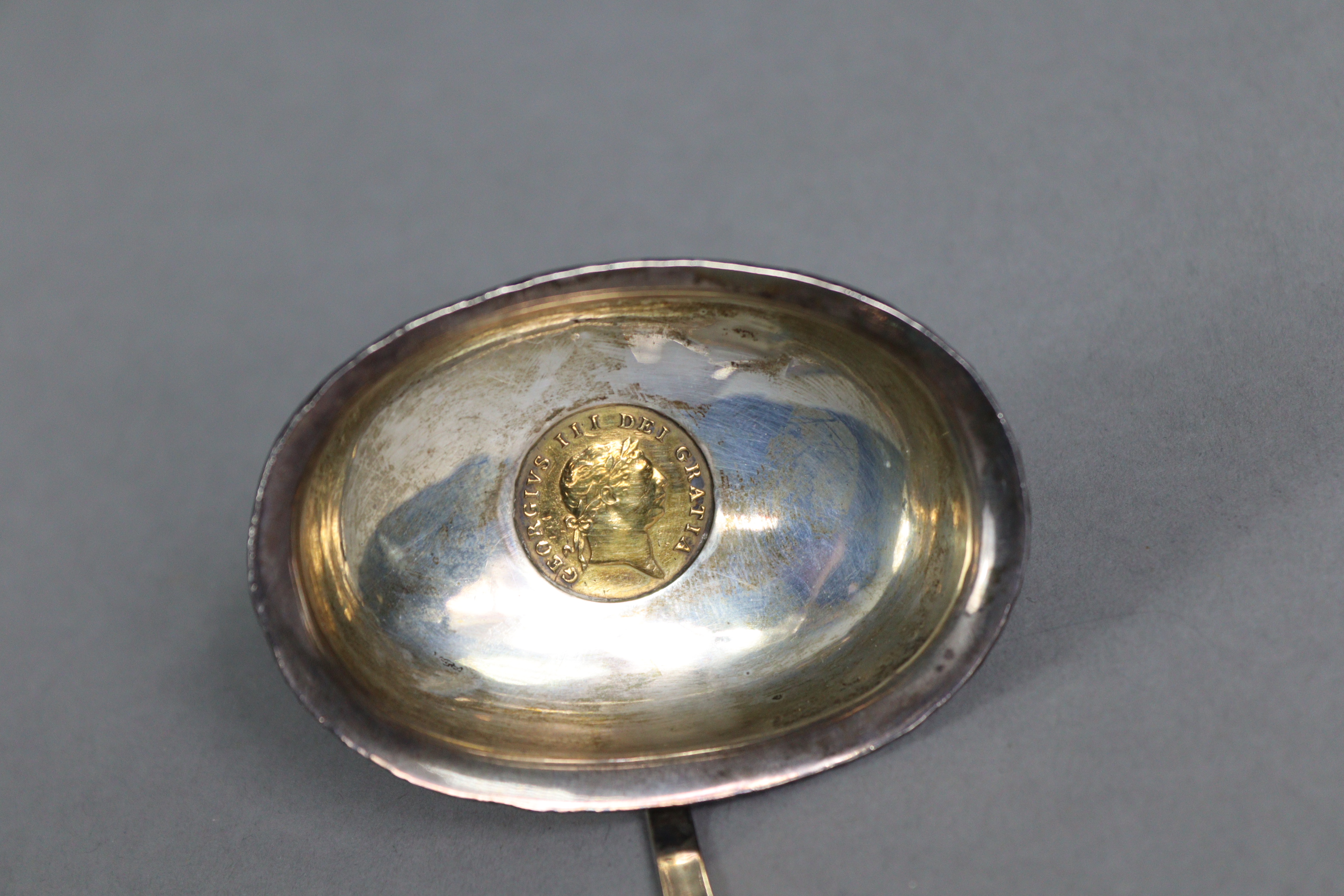 A silver toddy 'coin' ladle with spiral-twist whalebone handle, inset George III half guinea to the - Image 2 of 5