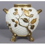 A Royal Worcester ovoid two-handled vase of basket-weave design, with raised decoration of flowering