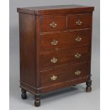 A Victorian mahogany chest with rounded corners to the plain rectangular top, fitted two short &