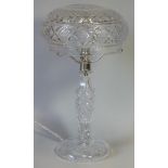 A good quality heavy cut glass table lamp with 9½” diam. domed shade, on slender column & circular