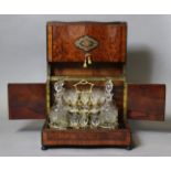 A mid-19th century French rosewood, amboyna, & brass-inlaid liqueur cabinet, fitted removable tray