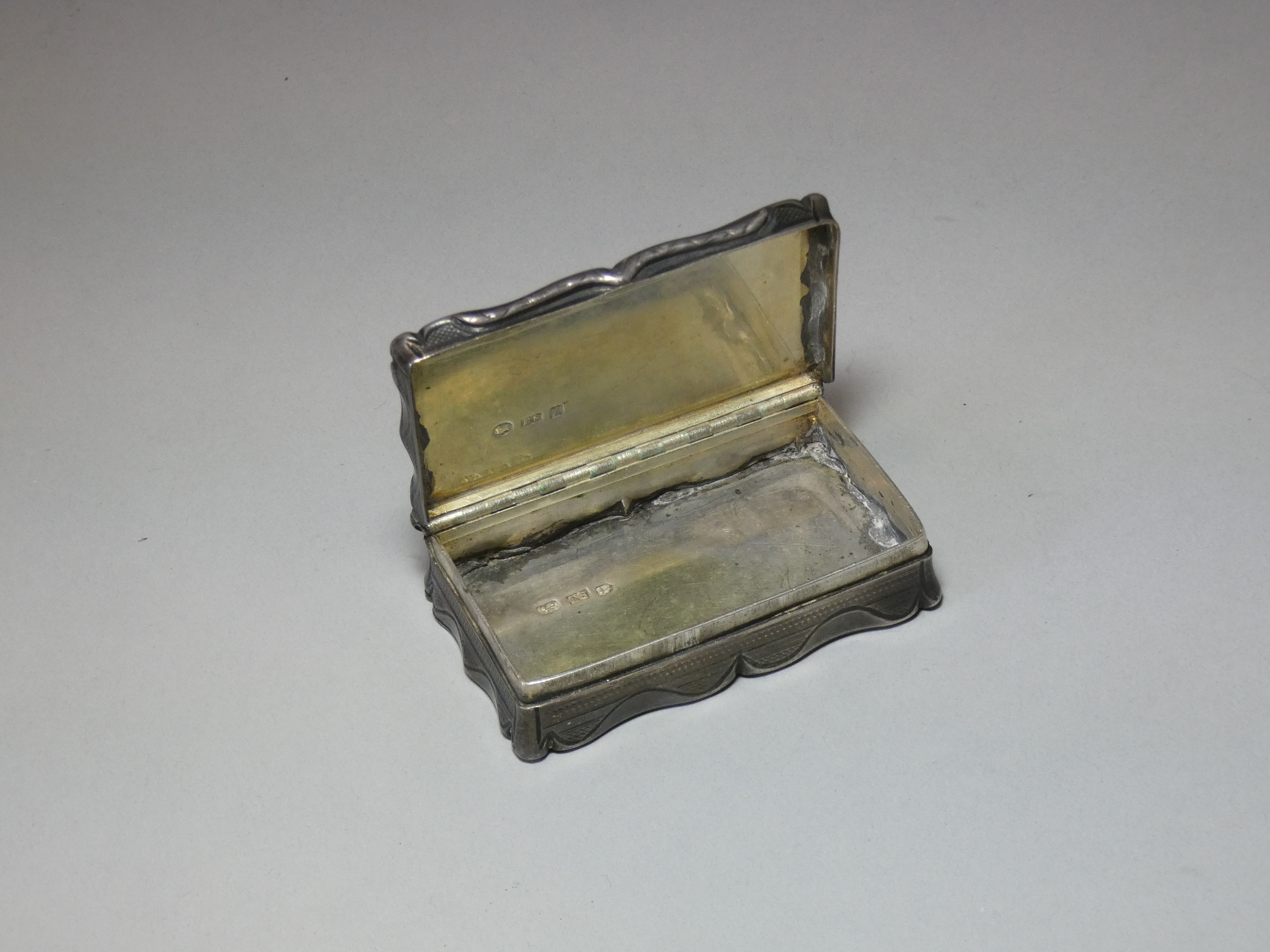 A Victorian silver snuff box, of shaped rectangular form with engine-turned decoration, engraved - Image 5 of 5