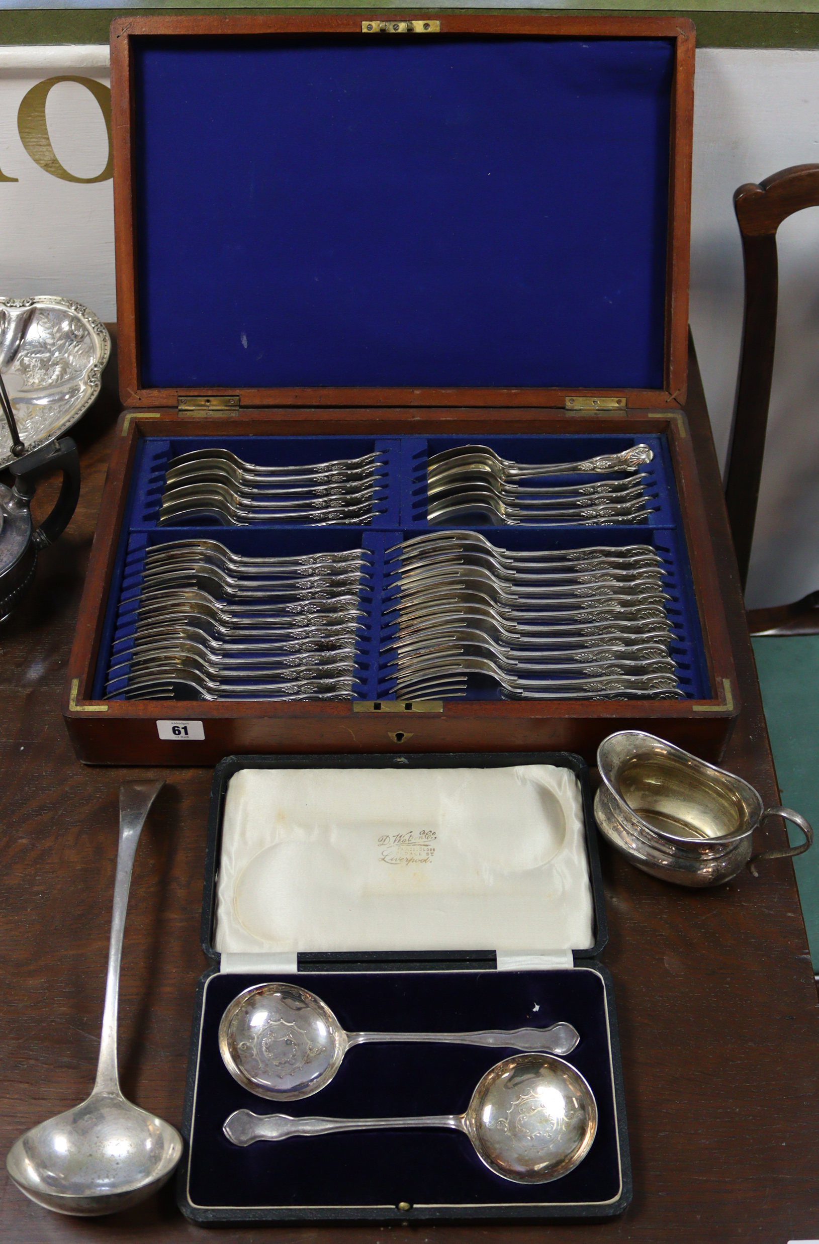 A large quantity of silver-plated items including three part-fitted canteens, various other cutlery,