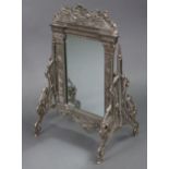 A 20th century silvered metal dressing table mirror with rectangular plate in neo-classical style