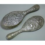 A late 19th/early 20th century Indian silver-backed hand mirror & matching hairbrush, with all-