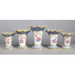 A garniture of five early/mid-19th century English porcelain graduated vases of round tapered form &