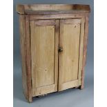 A pine tray-top small standing cupboard, fitted two shelves enclosed by pair of panel doors, 27¾”