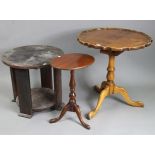 A reproduction yew wood tripod table with circular tilt-top, & on vase-turned centre column &