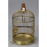 A brass-finish wirework birdcage, 24” high x 13½” diam.