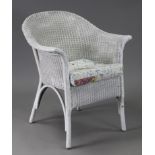 A white painted loom basket chair.