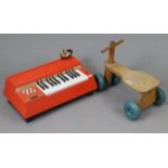 A Galt Toys wooden child’s bicycle; together with a Magnus “Major” electric chord organ; & two