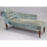 A late 19th/early 20th century chaise longue, with buttoned back & scroll end with sprung seat