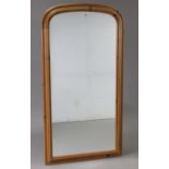 A pine frame rectangular wall mirror with rounded top, 51½” x 27”; & a beech oval cheval mirror,