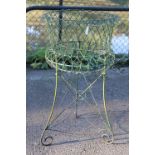 A green painted wire-work garden plant stand, 20” diameter x 33½” high.