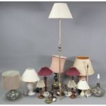 A brass standard lamp on triform base, with shade; & twelve various table lamp bases.