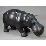 A large leather-covered composition model of a hippopotamus, 33” wide x 18” high, (slight faults